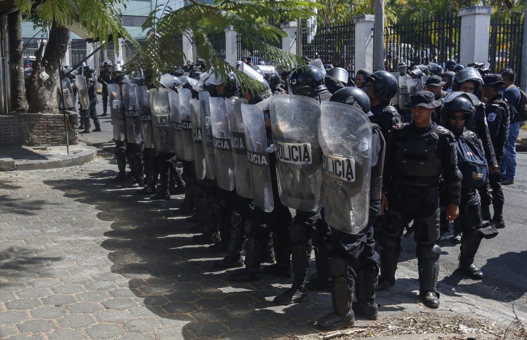 Police block anti-government protesters from marching in Managua, Nicaragua, Wednesday, April 17, 2019. Police prevented the march to commemorate a year since Nicaraguan protesters took to the streets to oppose the government of President Daniel Ortega. (AP Photo/Alfredo Zuniga)