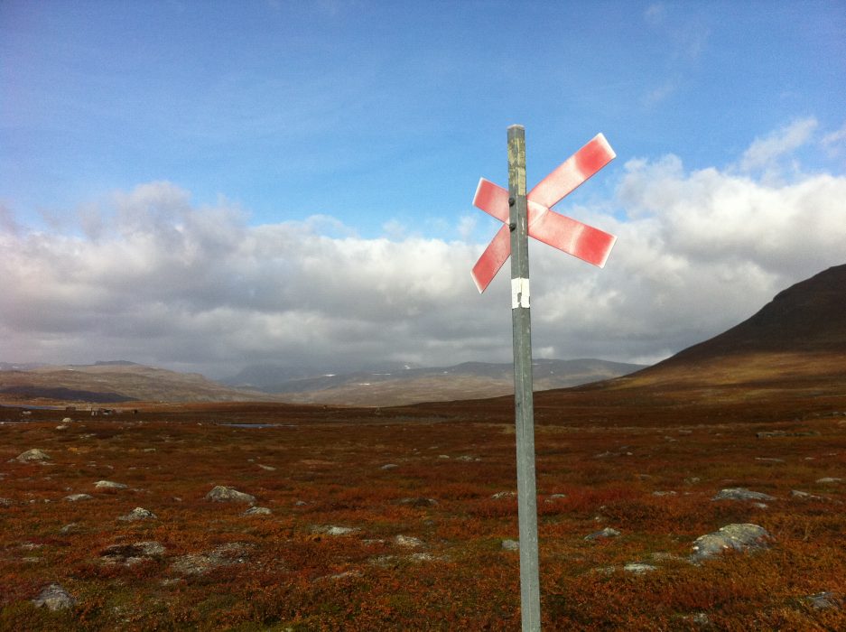 This September 2014 photo shows a marking for the snowmobile trail along Swedens popular Kungsleden trekking path. You'll find reindeer, bright red lingonberries and northern lights on a summer hike in Sweden's Arctic Circle, but rarely snow. (AP Photo/Cara Anna)