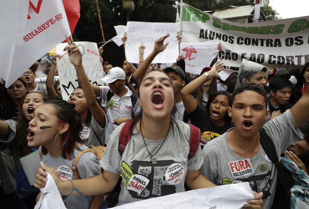 Demonstrators protest against a massive cut in the education budget imposed by the administration of Brazilian President Jair Bolsonaro, in Sao Paulo, Brazil, Wednesday, May 15, 2019. Federal education officials this month announced budget cuts of $1.85 billion for public education, part of a wider government effort to slash spending. (AP Photo/Andre Penner)