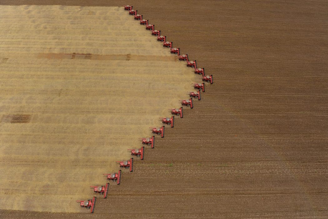 Workers on tractors harvest soybeans in Campo Novo do Parecis, in the Brazilian state of Mato Grosso, Thursday, March 5, 2009. Brazil is the world's second largest soy producer after the United States and the crop is one of the nation's principal exports. (AP Photo/Maurilio Cheli)