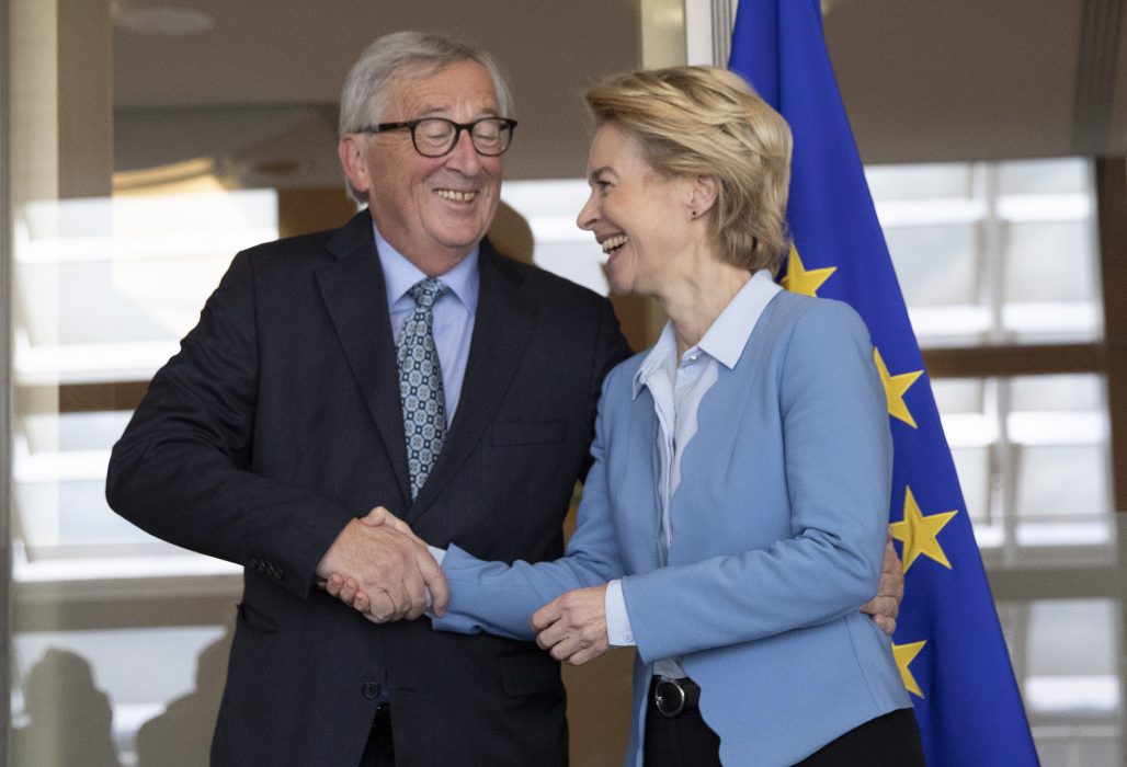 European Commission President Jean-Claude Juncker, left, greets incoming European Commission President Ursula von der Leyen prior to a lunch meeting at EU headquarters in Brussels, Monday, Sept. 9, 2019. (AP Photo/Virginia Mayo) VLM107