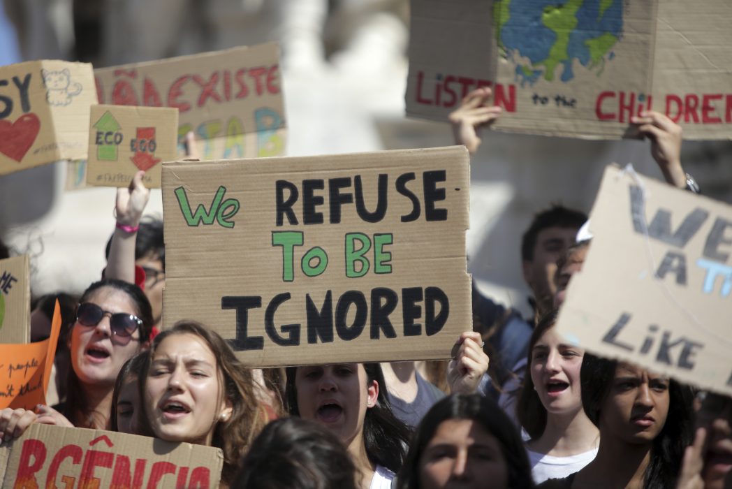 Demonstrators gather before a march through Lisbon during a climate strike of school students as part of the Fridays for Future movements Friday, May 24, 2019. Organizers expect more than one million young people to join protests over the world. (AP Photo/Armando Franca)