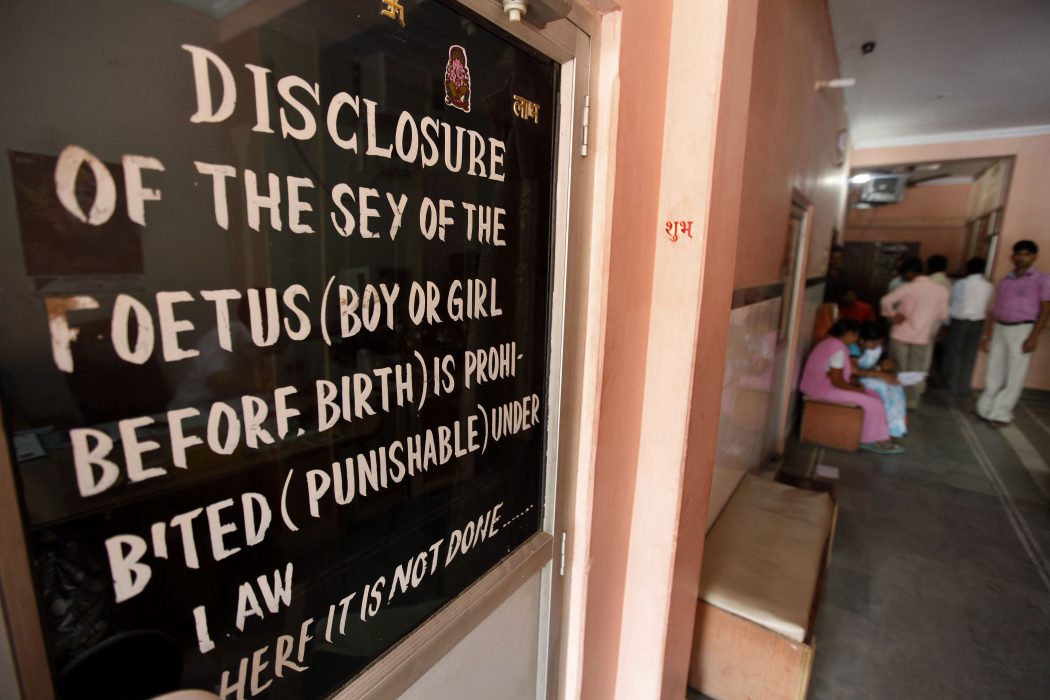 In this photo taken Wednesday, April 13, 2011, a graffiti against revealing the gender of unborn fetuses stands outside a clinic in Morena in the Central Indian State of Madhya Pradesh. Though abortion is allowed, India banned revealing the gender of unborn fetuses in 1994 in an attempt to stem the tide of sex-selective abortions. Early census results show India has only 914 girls under age six for every 1,000 boys. The census in Morena showed that for every 1,000 boys only 825 girls in the district made it to their sixth birthdays, down from an already troubling 829 a decade ago. (AP Photo/Mustafa Quraishi)