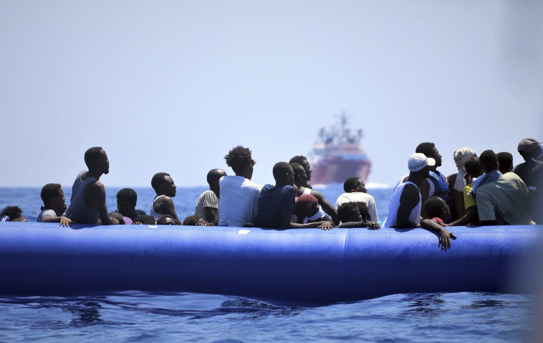 In this photo taken on Monday, Aug. 12, 2019, migrants on a dinghy boat wait to be assisted by the Ocean Viking ship, operated by the NGOs Sos Mediterranee and Doctors Without Borders, in the Mediterranean Sea. More than 500 rescued migrants are stuck in the Mediterranean on two NGO boats, as Italy and Malta continue to deny them access to their ports. French charity group Doctors Without Borders (MSF) said late Monday in a tweet that it had completed "a critical rescue" of another 105 people onto the Ocean Viking, raising the total number of migrants on board ship to 356. (Hannah Wallace Bowman/MSF/SOS Mediterranee via AP)