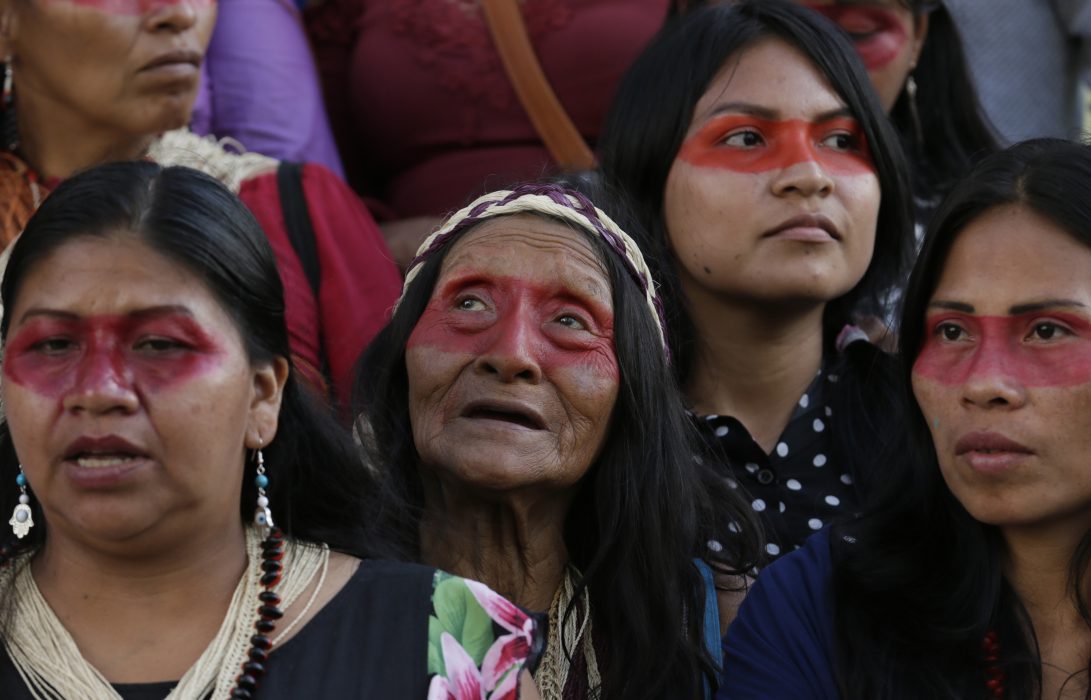 Ecuadorian Amazon Indigenous people of different ethnic groups, led by the Waorani protest in front of PetroEcuador in Quito, Ecuador, Thursday, May 16, 2019. They are demanding that the government refrain from extracting natural resources from their soil. The Waorani won an early court victory recently to stop oil extraction. (AP Photo/Dolores Ochoa)