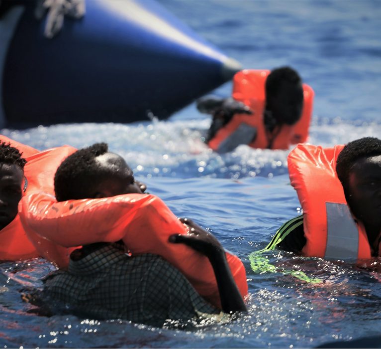 Migrants at sea are rescued by the Ocean Viking ship, operated by the NGOs Sos Mediterranee and Doctors Without Borders, in the Mediterranean Sea, Tuesday, Aug. 13, 2019. More than 500 rescued migrants are stuck in the Mediterranean on two NGO boats, as Italy and Malta continue to deny them access to their ports. French charity group Doctors Without Borders (MSF) said late Monday in a tweet that it had completed "a critical rescue" of another 105 people onto the Ocean Viking, raising the total number of migrants on board ship to 356. (Hannah Wallace Bowman/MSF/SOS Mediterranee via AP)