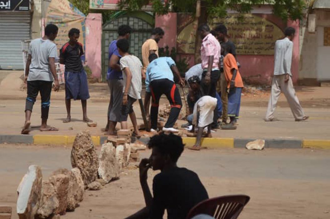 Bricks are laid by protesters to block a street in the Sudanese capital Khartoum to stop military vehicles from driving through the area on Wednesday, June 5, 2019. The death toll in Sudan amid a violent crackdown on pro-democracy protesters and the dispersal of their peaceful sit-in earlier this week in the capital climbed on Wednesday, protest organizers said. (Mohammed Najib via AP)