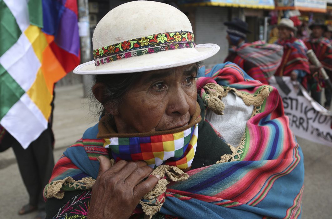 Quechua indigenous woman from the Qhara Qhara ethnic group marches to the capital to demand the state recognize what her community considers their ancestral land in the south, as she arrives to La Paz, Bolivia, Monday, March 18, 2019. The demonstrators have been walking for over a month, starting on Feb. 6 in the city of Sucre, in the department of Chuquisaca. (AP Photo/Juan Karita)