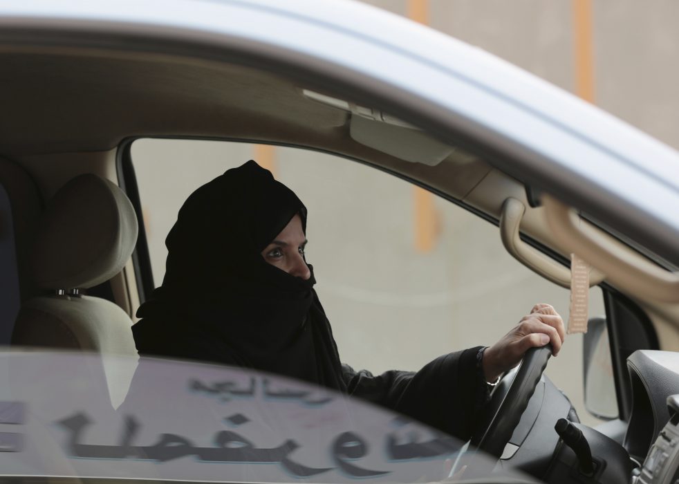 FILE - In this March 29, 2014 file photo, Aziza al-Yousef drives a car on a highway in Riyadh, Saudi Arabia, as part of a campaign to defy Saudi Arabia's ban on women driving. Saudi authorities have detained at least six activists, including three of the country's most prominent women's rights campaigners, just weeks before the kingdom is set to lift a ban on women driving, people familiar with the arrests said Friday, May 18, 2018. (AP Photo/Hasan Jamali, File)